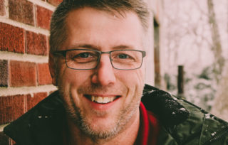 Canva Man in Black Leather Jacket Smiling